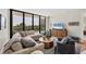 Contemporary living room features a large sectional, stylish decor, and an open balcony at 300 S Pineapple Ave # 302, Sarasota, FL 34236