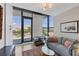 Bright living room offers city views, hardwood floors, and comfortable seating at 300 S Pineapple Ave # 302, Sarasota, FL 34236