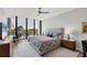 Bedroom with a large bed, floor to ceiling windows, and a seating area at 300 S Pineapple Ave # 302, Sarasota, FL 34236