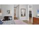 Bright main bedroom boasts a desk area, and an ensuite bathroom with a large mirror at 300 S Pineapple Ave # 302, Sarasota, FL 34236