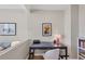 Comfortable office space featuring modern desk, chair, and custom shelving at 300 S Pineapple Ave # 302, Sarasota, FL 34236