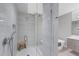 Elegant walk-in shower features designer tile, a rain shower head, and a built-in niche at 300 S Pineapple Ave # 302, Sarasota, FL 34236
