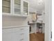 Walk-in closet with built-in shelving, drawers, and a chandelier providing ample storage space at 300 S Pineapple Ave # 302, Sarasota, FL 34236