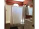 Bathroom showcases an updated vanity and a shower with a white curtain at 3405 54Th W Dr # 104, Bradenton, FL 34210