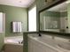Bathroom features a large garden tub, double sink vanity, and ample natural light at 3405 54Th W Dr # 104, Bradenton, FL 34210