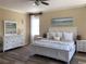 Serene bedroom with a white bed, dresser, and nightstands, creating a calm and inviting space at 3405 54Th W Dr # 104, Bradenton, FL 34210