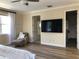 Bedroom featuring a ceiling fan, and a chaise lounge for relaxation, flooded with natural light at 3405 54Th W Dr # 104, Bradenton, FL 34210