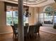 Elegant dining room with hardwood floors, chandelier, and a decorative window seat at 3405 54Th W Dr # 104, Bradenton, FL 34210