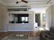 Living area view into kitchen and dining area with seamless flow at 3405 54Th W Dr # 104, Bradenton, FL 34210