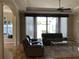 Bright living room with hardwood floors, comfortable seating, and large windows at 3405 54Th W Dr # 104, Bradenton, FL 34210