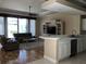 Open-concept living area featuring a kitchen counter and comfortable seating at 3405 54Th W Dr # 104, Bradenton, FL 34210