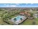 Aerial view of a pool, clubhouse, playground, and park in a residential community at 3415 Big Sky Way, Bradenton, FL 34211