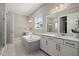 Bathroom with double vanities, garden tub and neutral tones for a relaxing atmosphere at 3415 Big Sky Way, Bradenton, FL 34211