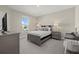 Cozy bedroom with neutral colors, large window, and coordinated furniture at 3415 Big Sky Way, Bradenton, FL 34211