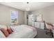 Charming bedroom with a window seat, plush decor, and a modern white dresser providing a delightful space at 3415 Big Sky Way, Bradenton, FL 34211