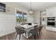 Cozy breakfast nook features a modern chandelier and a view to outdoor living at 3415 Big Sky Way, Bradenton, FL 34211