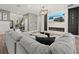 Comfortable living room features a modern fireplace, stylish decor, and an open layout for easy entertaining at 3415 Big Sky Way, Bradenton, FL 34211