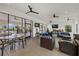 Modern clubhouse lounge area with sofas, tables, and access to the patio at 3415 Big Sky Way, Bradenton, FL 34211