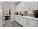 Spacious pantry with ample cabinet space, quartz countertops, and stylish backsplash at 3415 Big Sky Way, Bradenton, FL 34211