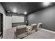 Home theater room with a large screen, comfortable seating, and ambient lighting at 3415 Big Sky Way, Bradenton, FL 34211