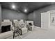 Home theater room with reclining seats, projector, and sleek decor at 3415 Big Sky Way, Bradenton, FL 34211