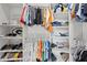 Organized walk-in closet with shelves and hanging rods providing ample storage for clothes and accessories at 3415 Big Sky Way, Bradenton, FL 34211