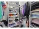 Organized walk-in closet with ample shelving, hanging space, and efficient storage solutions at 3415 Big Sky Way, Bradenton, FL 34211