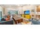 Spacious living room with comfortable seating, vaulted ceilings, and a large TV at 3605 Quail Hollow Ln, Bradenton, FL 34210