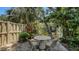 Tranquil outdoor patio space featuring a round table with pond views for relaxing and enjoying nature at 3605 Quail Hollow Ln, Bradenton, FL 34210