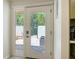 Patio door with side window leading to an outdoor sitting area at 3605 Quail Hollow Ln, Bradenton, FL 34210