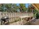 Outdoor patio area featuring a dining table, chairs, grill, and brick pavers, perfect for entertaining at 3605 Quail Hollow Ln, Bradenton, FL 34210
