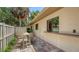 Outdoor patio with brick flooring and neutral-colored patio furniture, creating a cozy and inviting atmosphere at 3605 Quail Hollow Ln, Bradenton, FL 34210