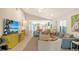 Open living room with contemporary decor, seamless flow into kitchen, and abundant natural light at 3605 Quail Hollow Ln, Bradenton, FL 34210