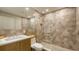 Modern bathroom featuring a glass shower, hexagon tiles, and a stylish vanity at 3605 Quail Hollow Ln, Bradenton, FL 34210