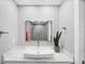 Bathroom features a modern vessel sink, quartz countertop, and a walk-in shower at 3955 Glen Oaks Manor Dr, Sarasota, FL 34232