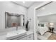 Bathroom features a modern vessel sink, quartz countertop, and a walk-in shower at 3955 Glen Oaks Manor Dr, Sarasota, FL 34232