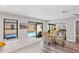 Open concept living with dining area, and views of the pool from multiple rooms at 3955 Glen Oaks Manor Dr, Sarasota, FL 34232