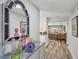 Stylish entryway leading to an open living area, featuring modern decor and hardwood floors at 3955 Glen Oaks Manor Dr, Sarasota, FL 34232