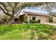 Inviting single-story home with well-maintained landscaping and a cozy front yard at 3955 Glen Oaks Manor Dr, Sarasota, FL 34232