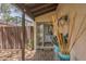 Charming front porch with decorative plants, mosaic tile, and courtyard access at 3955 Glen Oaks Manor Dr, Sarasota, FL 34232
