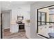Modern kitchen featuring stainless steel appliances and natural light from an adjacent private patio at 3955 Glen Oaks Manor Dr, Sarasota, FL 34232