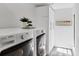 Clean laundry room features a modern washer and dryer, storage cabinets, and decorative plants at 3955 Glen Oaks Manor Dr, Sarasota, FL 34232