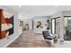 Spacious living area featuring modern design, wood floors, and an open layout at 3955 Glen Oaks Manor Dr, Sarasota, FL 34232