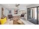 Open-concept living area with modern seating, decor, and courtyard views at 3955 Glen Oaks Manor Dr, Sarasota, FL 34232