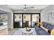 Cozy living room opens to outdoor pool area, providing seamless indoor-outdoor living at 3955 Glen Oaks Manor Dr, Sarasota, FL 34232