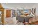 Spacious living room featuring hardwood floors, neutral colors, and a view of the outdoor courtyard at 3955 Glen Oaks Manor Dr, Sarasota, FL 34232