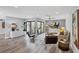 Elegant living room showcasing modern decor, stylish seating, and courtyard access at 3955 Glen Oaks Manor Dr, Sarasota, FL 34232