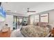 Bright main bedroom with a view to an outdoor workspace and private outdoor space at 3955 Glen Oaks Manor Dr, Sarasota, FL 34232