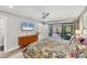Comfortable main bedroom offering a TV and a view of the outdoor pool at 3955 Glen Oaks Manor Dr, Sarasota, FL 34232