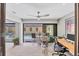 Bright office with a ceiling fan and sliding glass doors that overlook the sparkling pool at 3955 Glen Oaks Manor Dr, Sarasota, FL 34232